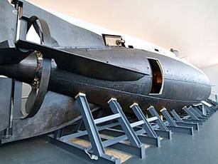 A photo of a large preserved submarine inside a museum